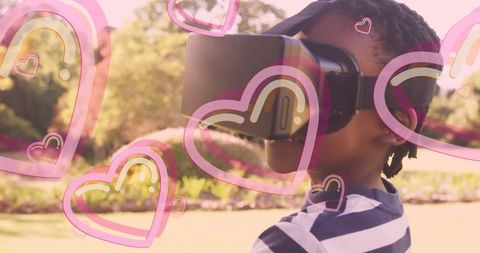 Child Enjoying Virtual Reality Headset in Sunny Garden