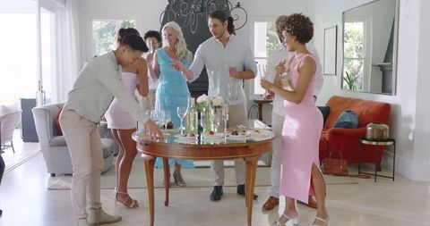 Group Gathering in Modern Kitchen Preparing for Celebration