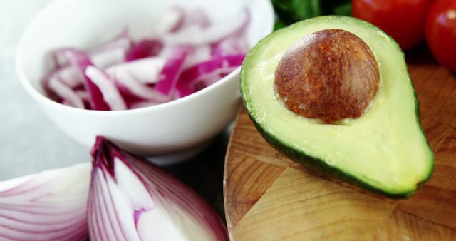 Fresh Sliced Avocado and Red Onions on Wooden Board - Download Free Stock Images Pikwizard.com