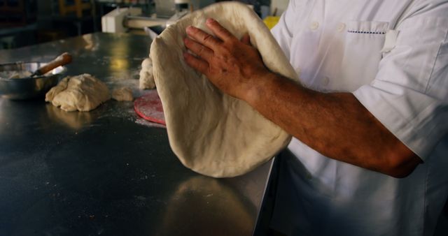 Baker Shaping Dough by Hand in Professional Kitchen, Perfecting the Craft - Download Free Stock Images Pikwizard.com