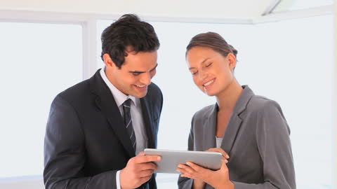 Business Professionals Engaging with Digital Tablet