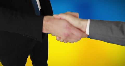 Business Handshake Over Ukraine Flag Symbolizing Cooperation - Download Free Stock Images Pikwizard.com