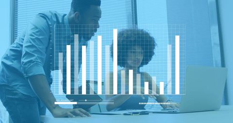 Diverse Team Analyzing Business Financial Data on Laptop