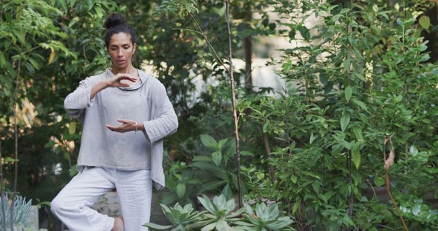 Woman Practicing Yoga in Lush Garden Setting - Download Free Stock Images Pikwizard.com