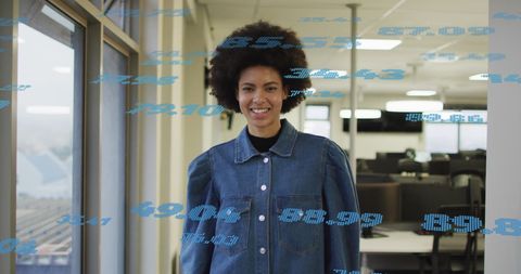 Biracial Businesswoman Overseeing Financial Data in Office