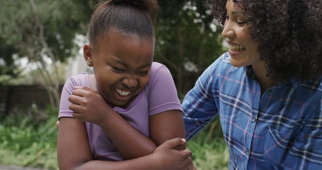 Mother and Daughter Laughing Outdoors in Urban Park - Download Free Stock Images Pikwizard.com