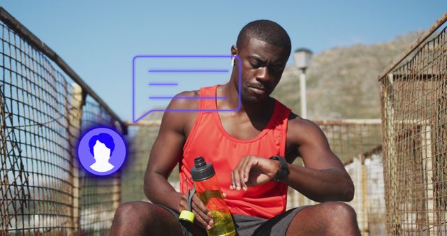 Young, athletic man participating in an outdoor workout, checking time on his watch, holding water bottle. Ideal for content related to sports, fitness, hydration, and healthy living. Perfect for articles or promotional materials on endurance training, exercise routines, or personal fitness.