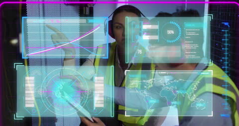 Diverse Technicians Analyzing Data in Modern Server Room