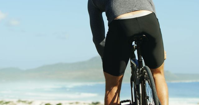 Cyclist Enjoying Scenic Ride Along Coastal Route - Download Free Stock Images Pikwizard.com