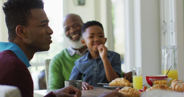 Smiling Family Eating Breakfast Together at Home - Download Free Stock Images Pikwizard.com