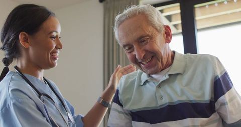 Healthcare Professional with Elderly Patient in Medical Setting