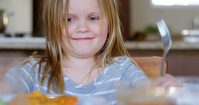 Happy Girl Enjoys Delicious Meal at Home Dining Table - Download Free Stock Images Pikwizard.com