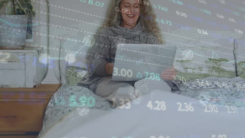 Businesswoman Analyzing Data on Laptop with Financial Interface