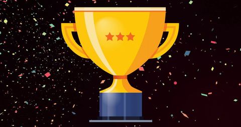 Gold trophy and confetti celebrating achievement