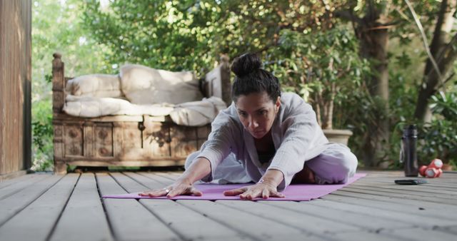 Woman Practicing Yoga on Wooden Deck Outdoors - Download Free Stock Images Pikwizard.com