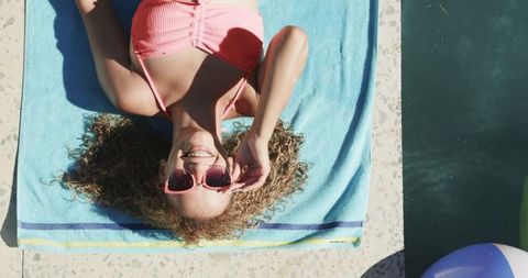 Young Woman Sunbathing Poolside Leisure Summer Outdoors