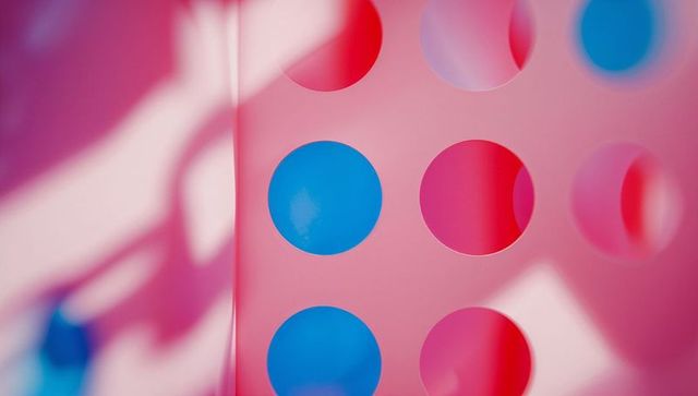 Vibrant pink and blue abstract geometric pattern panel