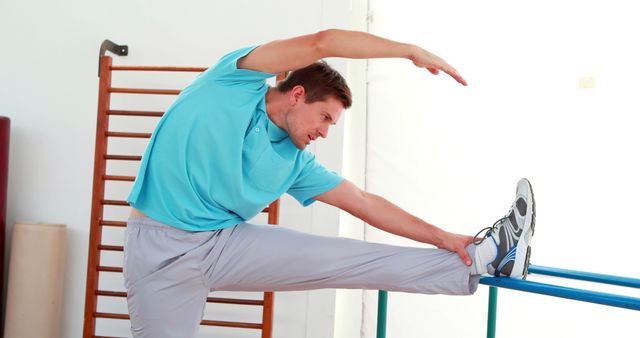 Young Man Stretching During Physio Session - Download Free Stock Images Pikwizard.com