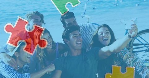 Friends on Beach Taking Selfie with Puzzle Piece Overlay Concept