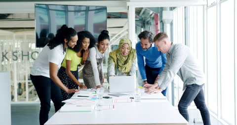 Diverse Creative Team Collaborating in Modern Workspace