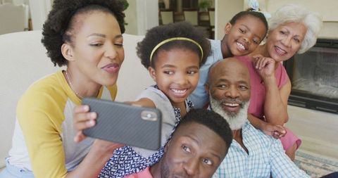 Multigenerational Family Celebrating with Selfie in Living Room