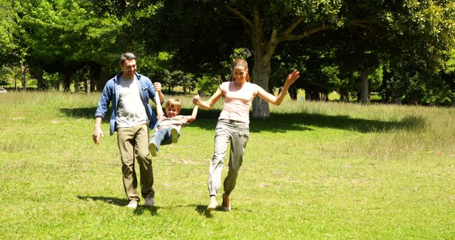 Happy Family Playing Together in Sunny Park - Download Free Stock Images Pikwizard.com