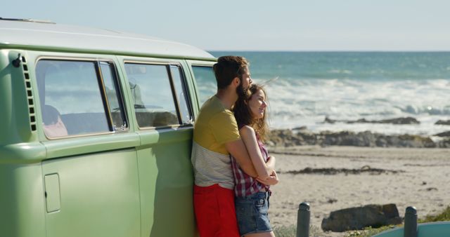 Young couple embracing near van on a sunny day. Couple romancing on beach 4k