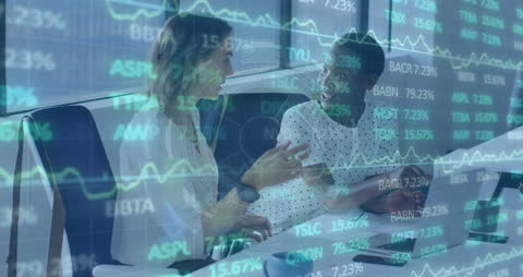 Multiracial Colleagues Discussing Financial Strategies with Digital Overlay