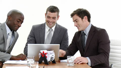 Collaborative Teamwork with Laptops in Business Meeting