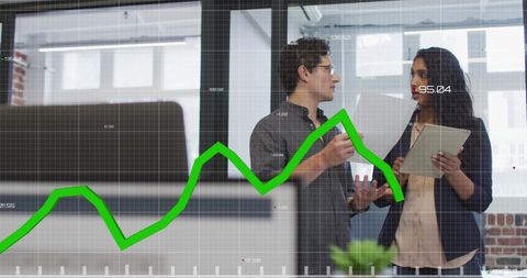 Diverse Team Analyzing Business Data Over Digital Graph Interface