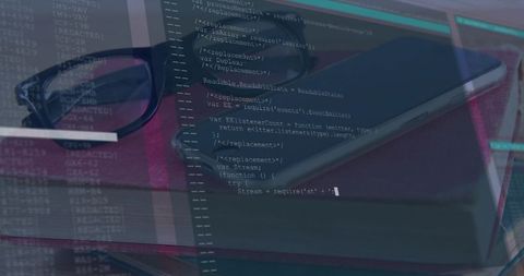 Resting glasses on notebook with code overlay conveying remote work and software development