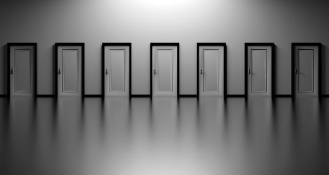 This image displays seven closed doors in a black and white hallway, representing choices and the uncertainty of decision-making. Ideal for illustrating concepts such as opportunities, life decisions, challenges, or exploring the unknown. Useful for websites, presentations, articles, or blogs focused on personal development, career paths, or business strategy.