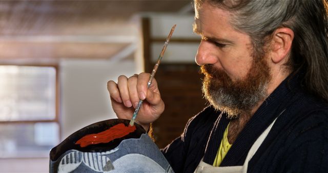 Artist Painting Ceramic Pot in Studio with Brush - Download Free Stock Images Pikwizard.com