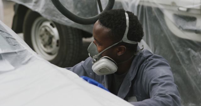 Auto Mechanic Spray Painting Car in Workshop - Download Free Stock Images Pikwizard.com