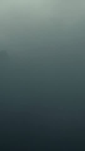 Three Cloaked Figures Walking Through Shifting Fog Vertical Mystic Silhouette Video