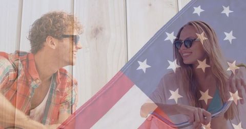 Couple Enjoying Outdoor Adventure with Patriotic Spirit