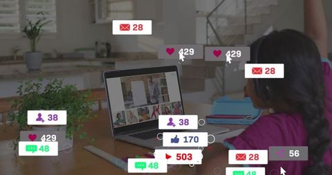Child raising hand during virtual classroom with laptop and social notification overlays