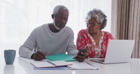 Senior Couple Managing Finances with Technology at Home