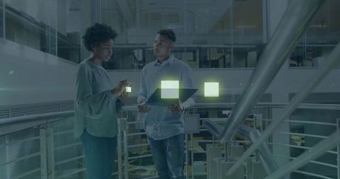 Business professionals discussing digital data with futuristic interface