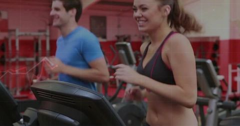 Smiling Woman on Treadmill at Gym with Jogging Partner