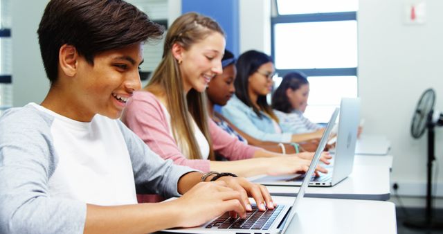 Group of Diverse Students Typing on Laptops in Classroom - Download Free Stock Images Pikwizard.com