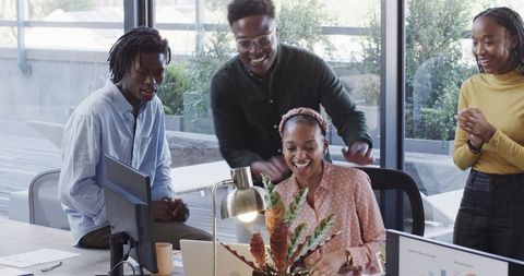 Smiling Team of Diverse Colleagues Collaborating in Modern Office