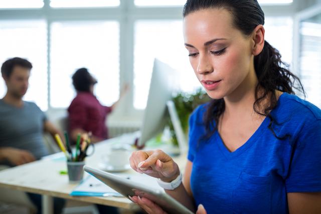 Female Graphic Designer Using Digital Tablet in Modern Office - Download Free Stock Images Pikwizard.com