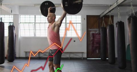Bald man performing overhead barbell lift in gym with rising performance chart overlay