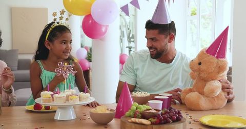 Father Daughter Birthday Celebration with Cake and Balloons
