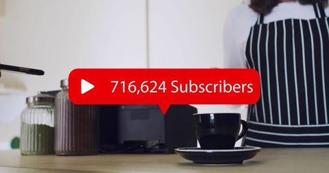 Black coffee cup on counter with barista apron and red subscribers overlay for content
