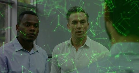 Business Team Collaborating on Augmented Reality Network Visualization in Modern Office