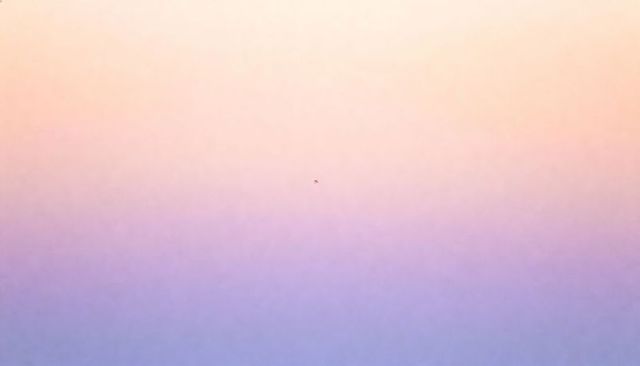 Drifting tiny speck across pastel gradient sky at sunrise minimal abstract negative-space