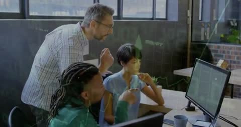 Team Analyzing Financial Growth on Monitor in Modern Office