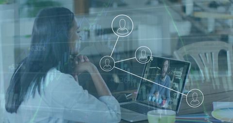 Businesswoman Engaging in Virtual Meeting with Digital Graph Overlays